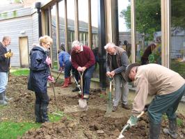 Members planting Crocus bulbs